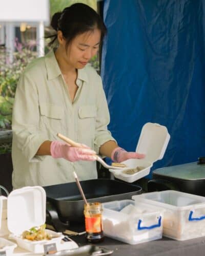 Serving dumplings at the Wednesday Market at Old Nick Village